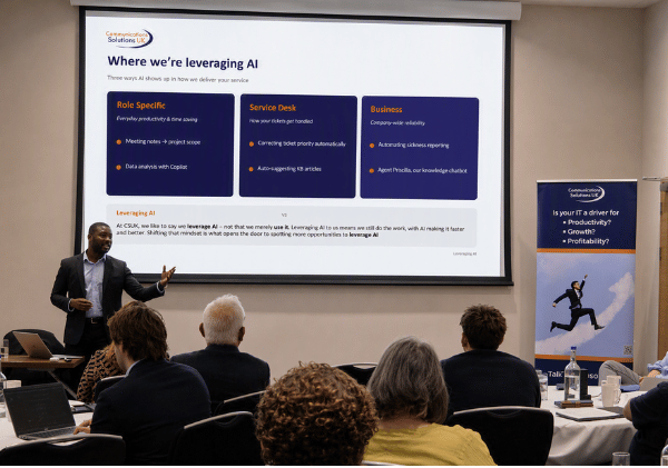 Speaker presenting practical applications of AI across service desk and business operations